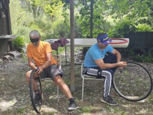 Blindfolded participants changing a bicycle tire